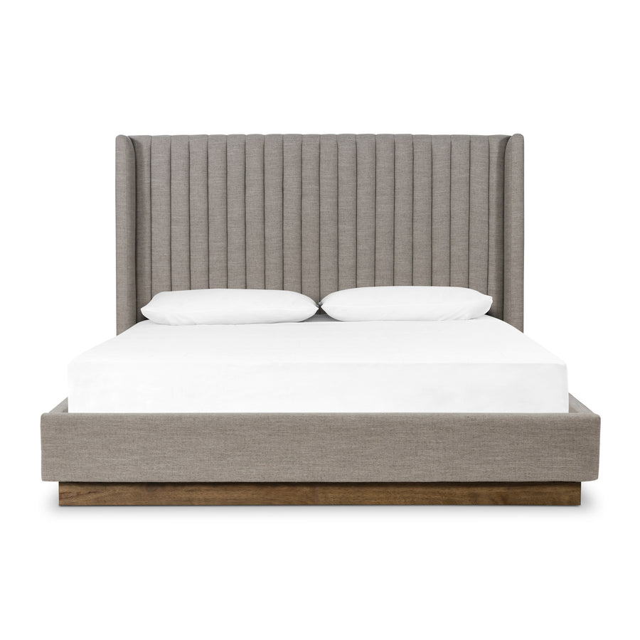 The Montgomery Bed is a tall, vertical-channeled headboard that is upholstered in grey high-performance fabric for a sensible take on modern bedroom styling. Amethyst Home provides interior design services, furniture, rugs, and lighting in the Dallas metro area.