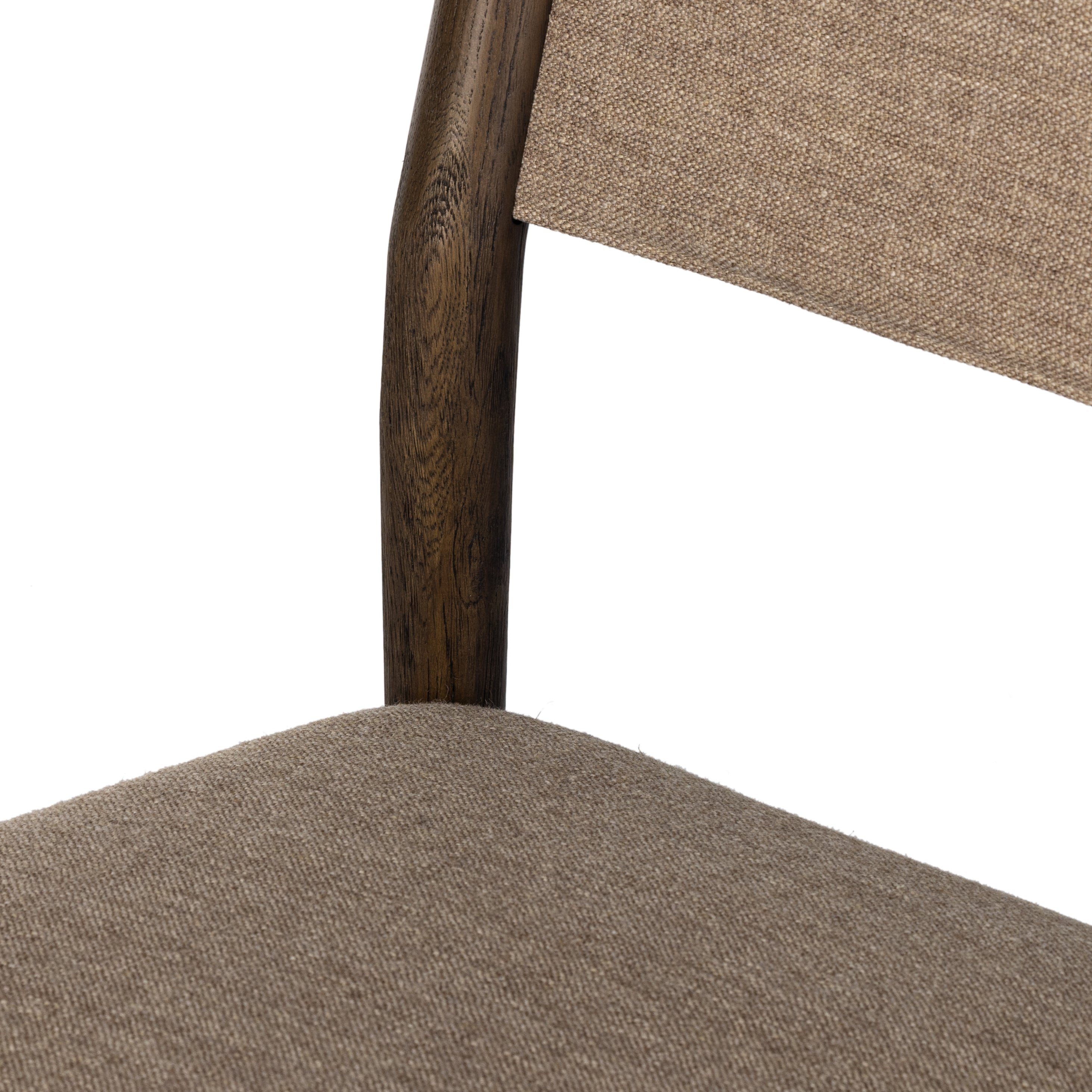 Mixed materials place a modern twist on the sling-back dining chair. A solid oak frame forms rounded dowel legs for a touch of traditionalism, with performance fabric perfect for everyday dining. Amethyst Home provides interior design, new construction, custom furniture and area rugs in the Laguna Beach metro area