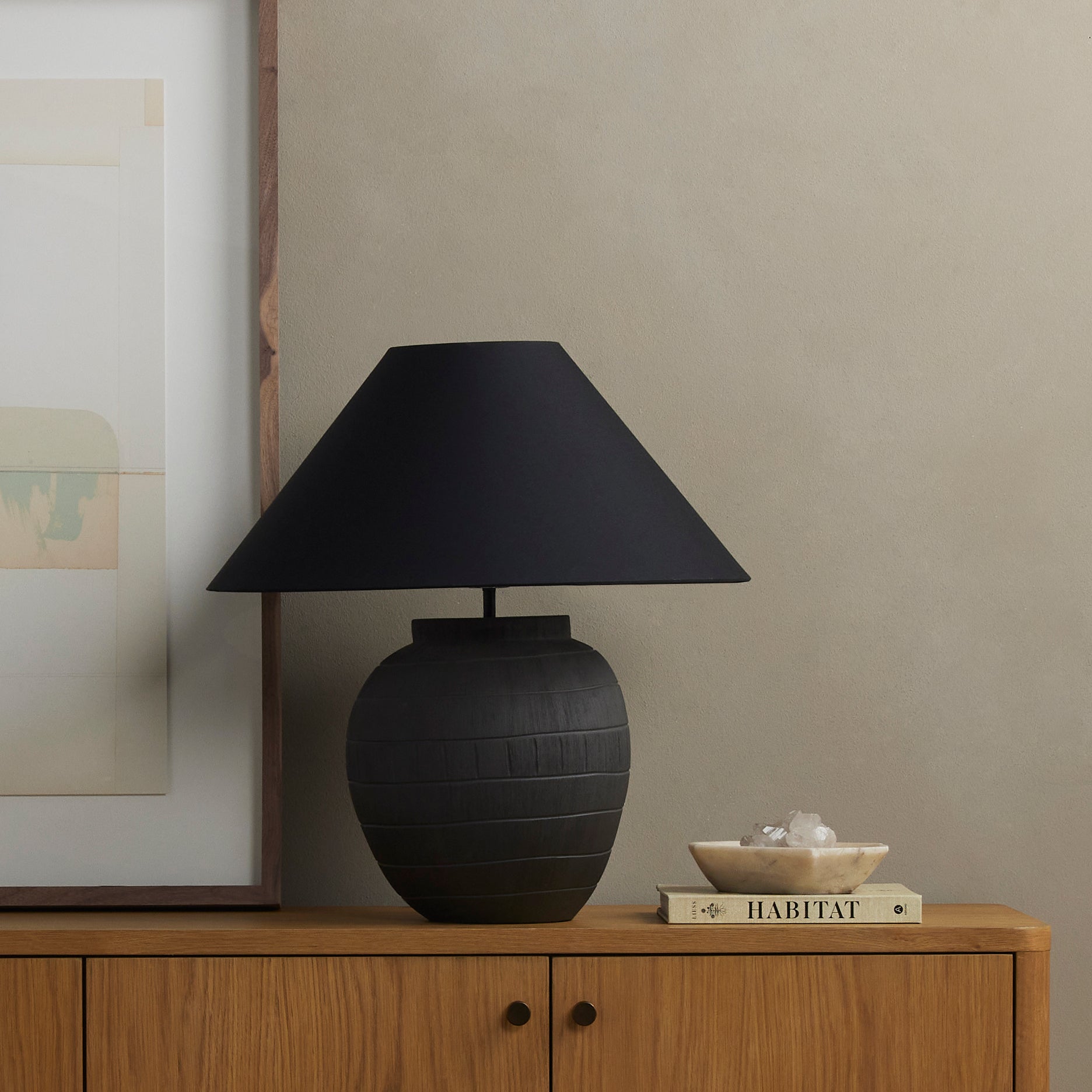 Muji Black Cotton Table Lamp is a hand-shaped black talavera lamp with handle-like detailing pairs with a tapered cotton shade in black. Amethyst Home provides interior design services, furniture, rugs, and lighting in the Miami metro area.