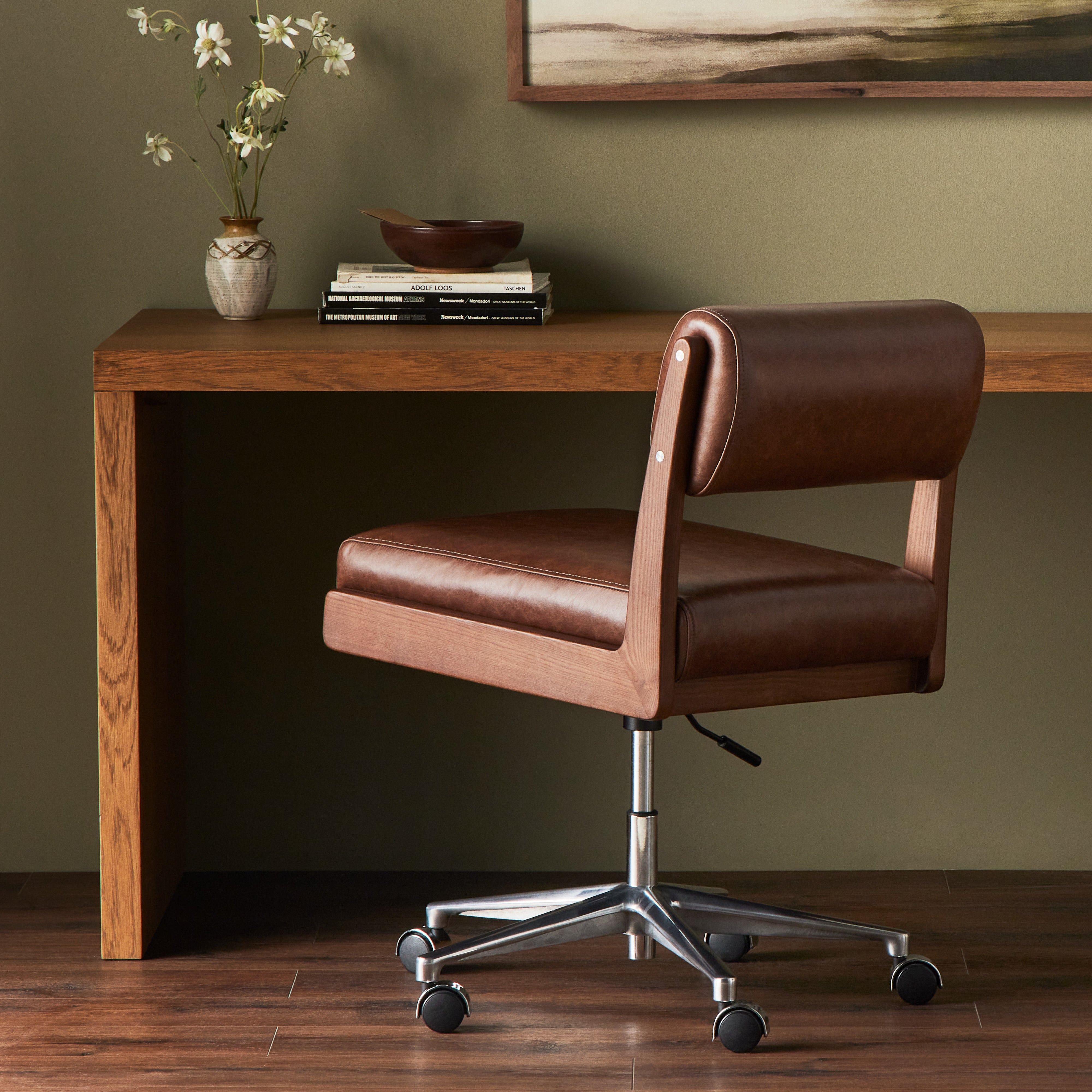 An armless top-grain leather seat and bolster pair with a wooden frame for an understated modern look with a hint of midcentury influence. Amethyst Home provides interior design, new construction, custom furniture, and area rugs in the Portland metro area.