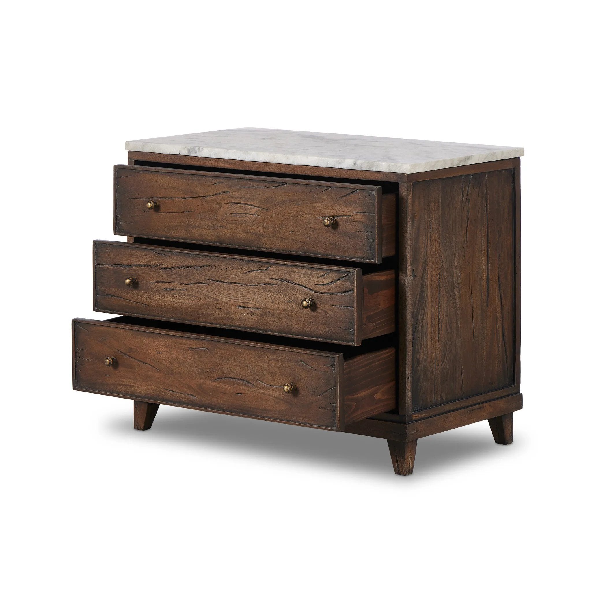 Capturing the charm of vintage French storage, this solid mango wood nightstand stands tall with a polished marble top and softened ogee edges. Three spacious drawers are fitted with classic brass-button hardware. Natural marks and cracks are characteristic of the reclaimed wood.Collection: Harmo Amethyst Home provides interior design, new home construction design consulting, vintage area rugs, and lighting in the Miami metro area.