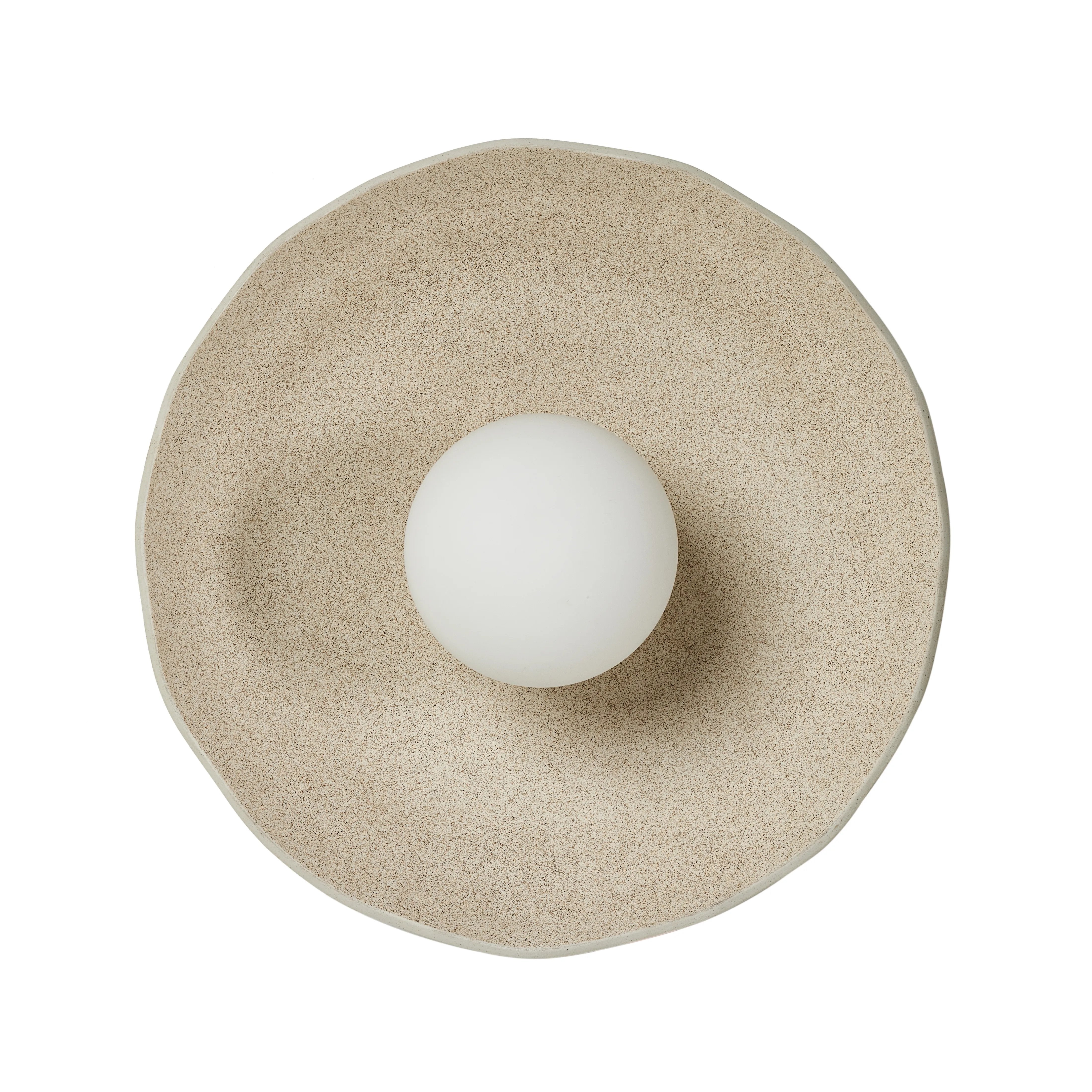 Organic in spirit. A light sand-colored porcelain disc is nestled in a slim iron frame for a spare but impactful look.Collection: Ryke Amethyst Home provides interior design, new home construction design consulting, vintage area rugs, and lighting in the Charlotte metro area.