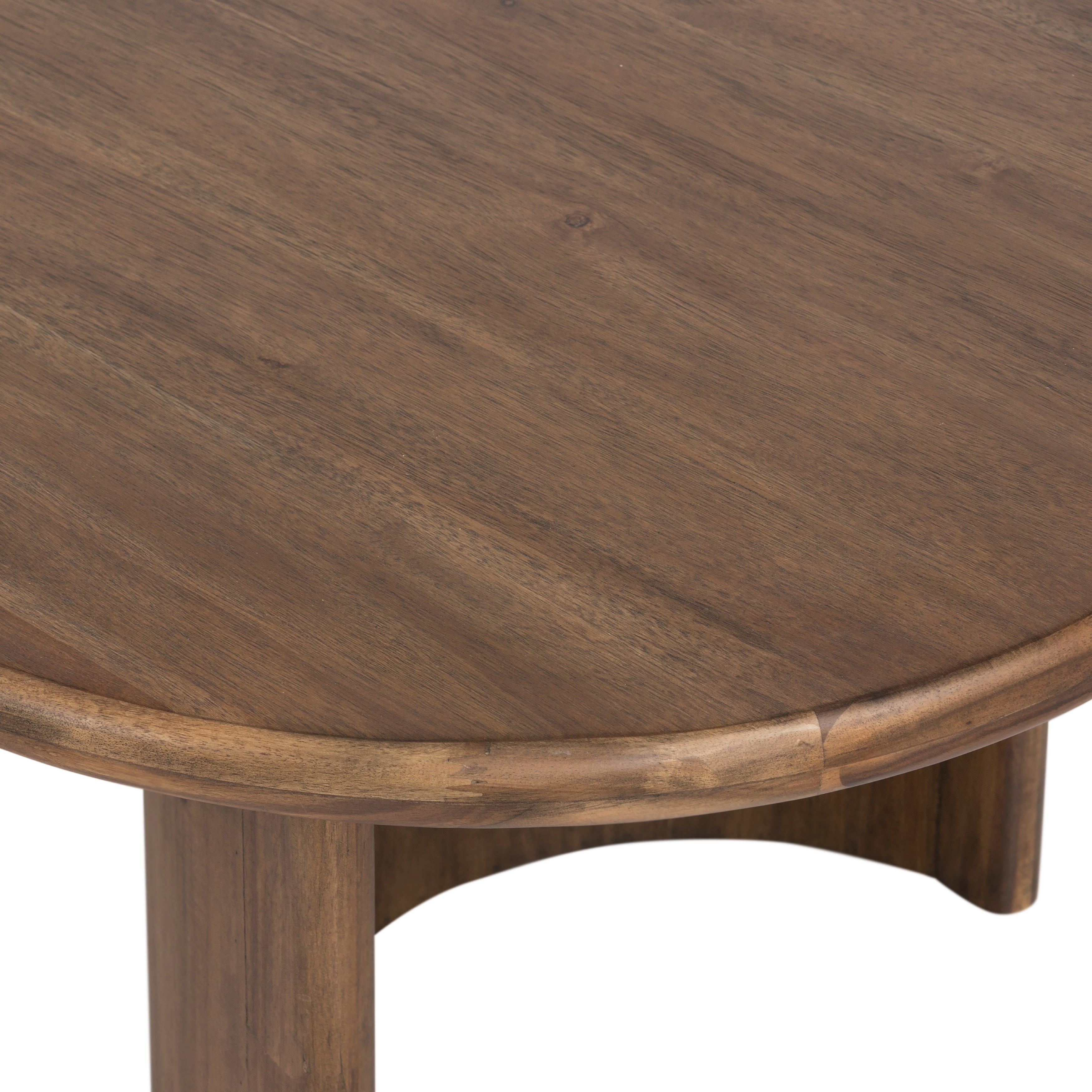 A study in shape. Solid brown acacia forms crescent-shaped legs and sprawling oval tabletop, bringing organic presence to the living room. Amethyst Home provides interior design, new construction, custom furniture and area rugs in the Des Moines metro area