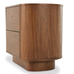 Seasoned brown acacia forms a curved pedestal base, bringing gentle curves to a classic nightstand shape. Amethyst Home provides interior design, new construction, custom furniture, and area rugs in the Laguna Beach metro area.