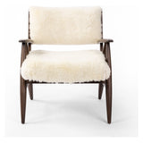 A modern take on the vintage school chair, upholstered in plush cream shearling of 100% sheepskin. Perfect as an accent chair or in pairs. Amethyst Home provides interior design, new construction, custom furniture, and area rugs in the Houston metro area.