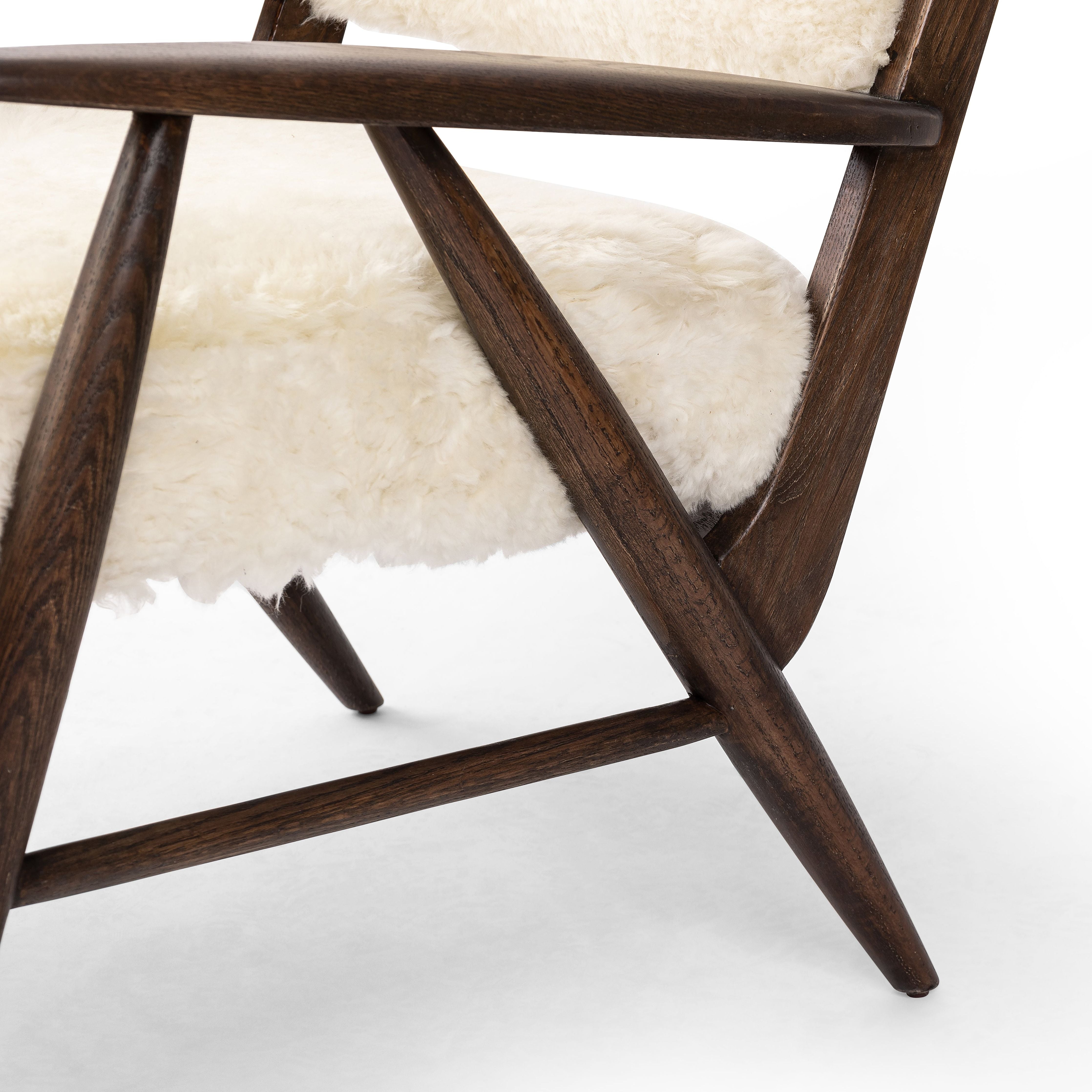 A modern take on the vintage school chair, upholstered in plush cream shearling of 100% sheepskin. Perfect as an accent chair or in pairs. Amethyst Home provides interior design, new construction, custom furniture, and area rugs in the Laguna Beach metro area.