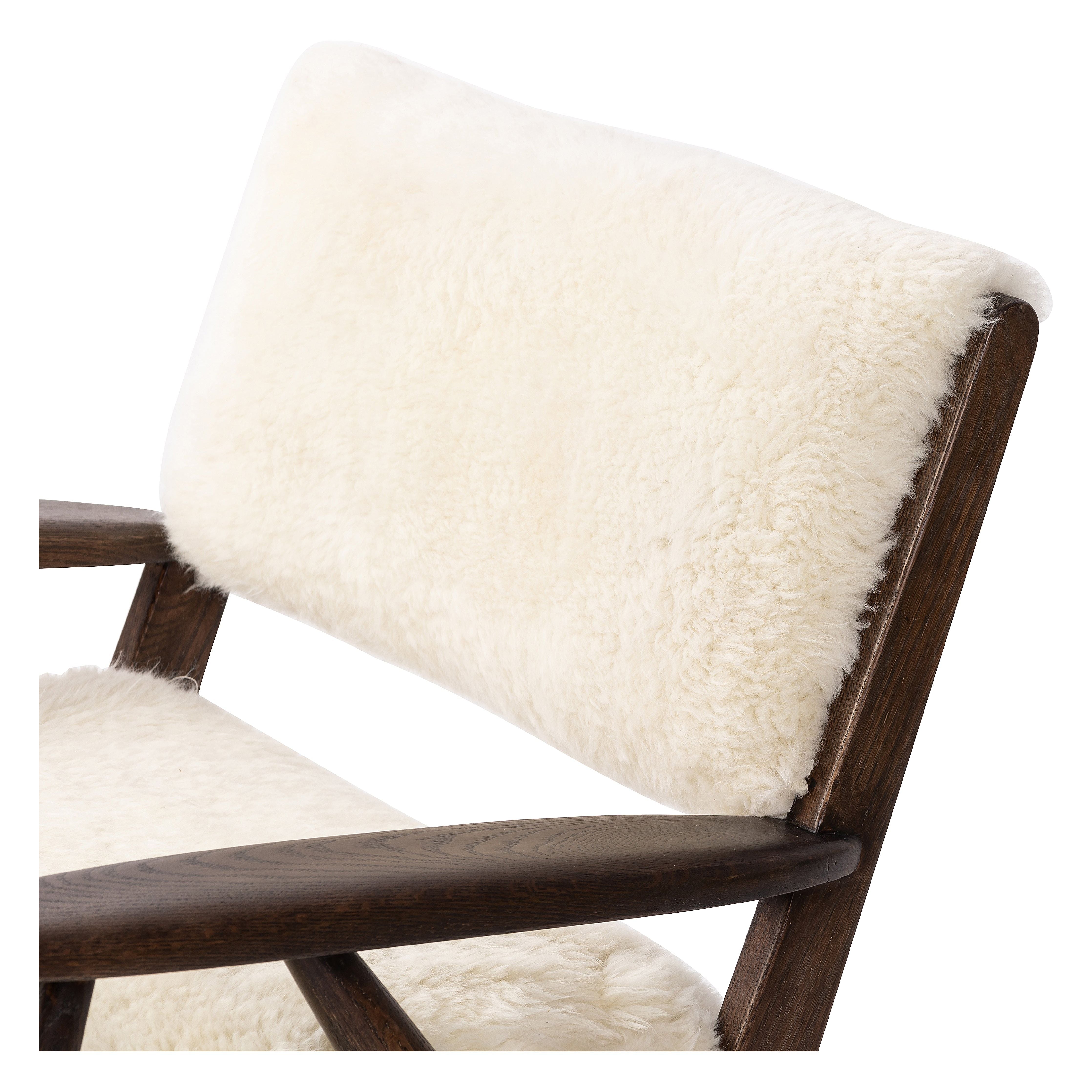 A modern take on the vintage school chair, upholstered in plush cream shearling of 100% sheepskin. Perfect as an accent chair or in pairs. Amethyst Home provides interior design, new construction, custom furniture, and area rugs in the San Diego metro area.