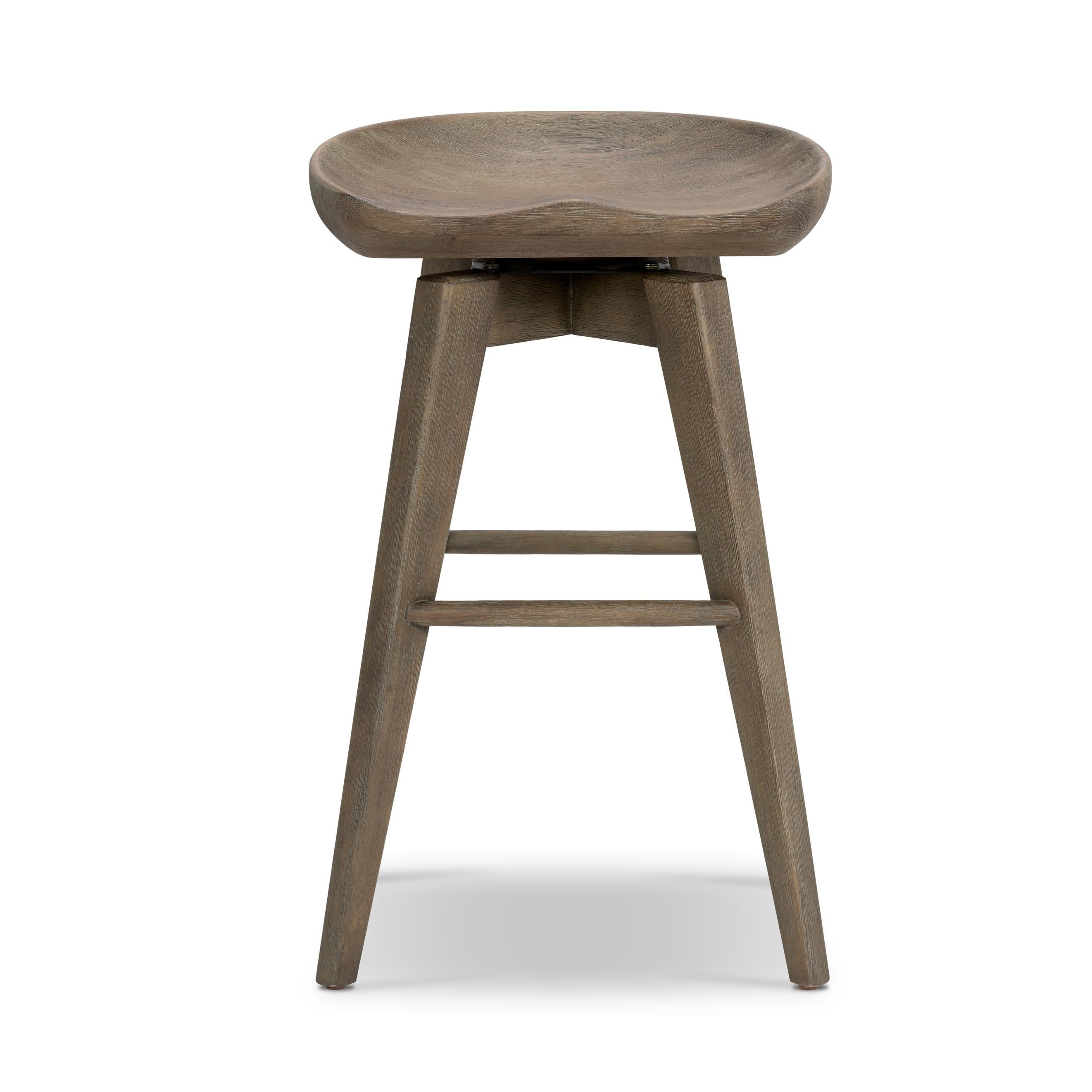 A fresh spin on bar seating, the parawood Paramore Swivel Counter Stool is finished in a deep charcoal for a clean, sleek look. The stool is topped with a swivel. Amethyst Home provides interior design, new home construction design consulting, vintage area rugs, and lighting in the San Diego metro area.