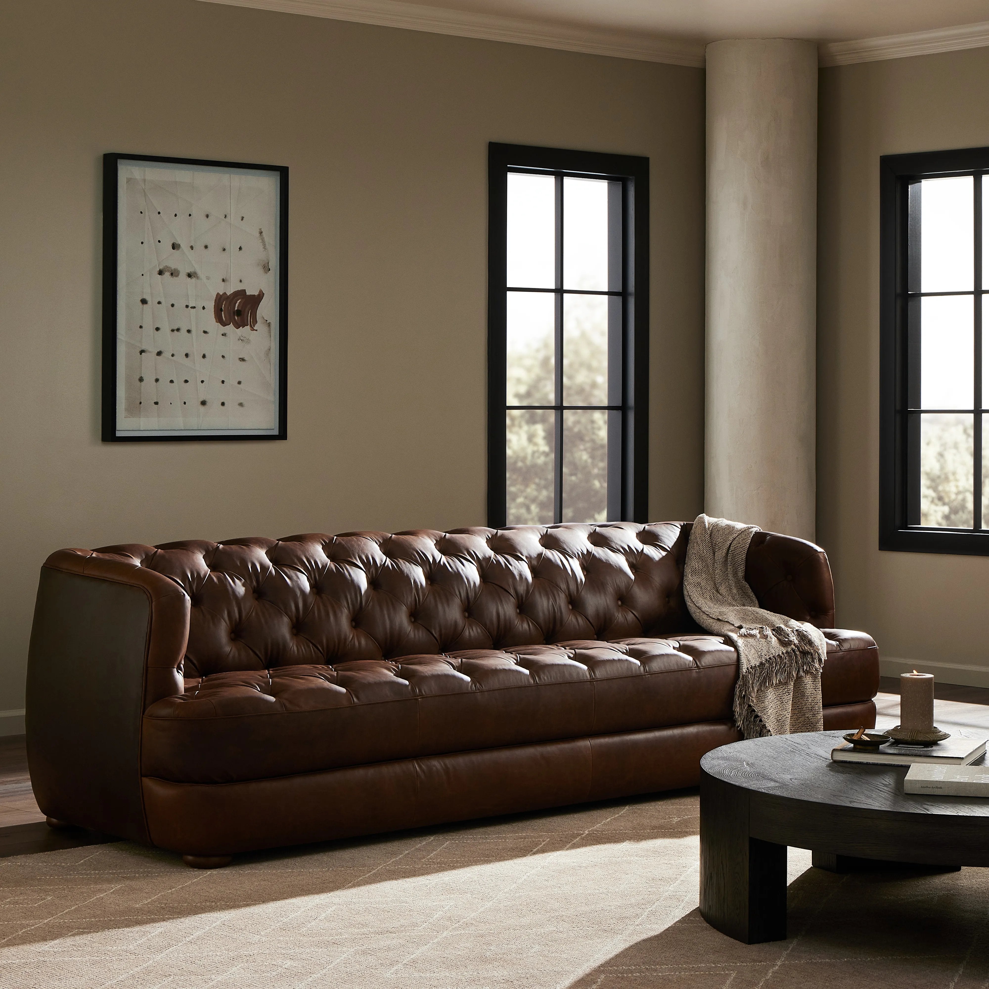 An Old English-inspired design is updated with button tufting across the back and arms. Upholstered in a top-grain leather finished with a soft hand for a vintage, lived-in look on this traditionally inspired sofa. Handcrafted in Italy, the richness of this distinctive, full-bodied leather develops an even-richer patina over time. Amethyst Home provides interior design, new home construction design consulting, vintage area rugs, and lighting in the Alpharetta metro area.