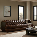 An Old English-inspired design is updated with button tufting across the back and arms. Upholstered in a top-grain leather finished with a soft hand for a vintage, lived-in look on this traditionally inspired sofa. Handcrafted in Italy, the richness of this distinctive, full-bodied leather develops an even-richer patina over time. Amethyst Home provides interior design, new home construction design consulting, vintage area rugs, and lighting in the Seattle metro area.
