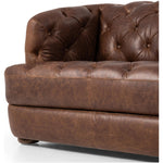 An Old English-inspired design is updated with button tufting across the back and arms. Upholstered in a top-grain leather finished with a soft hand for a vintage, lived-in look on this traditionally inspired sofa. Handcrafted in Italy, the richness of this distinctive, full-bodied leather develops an even-richer patina over time. Amethyst Home provides interior design, new home construction design consulting, vintage area rugs, and lighting in the Tampa metro area.