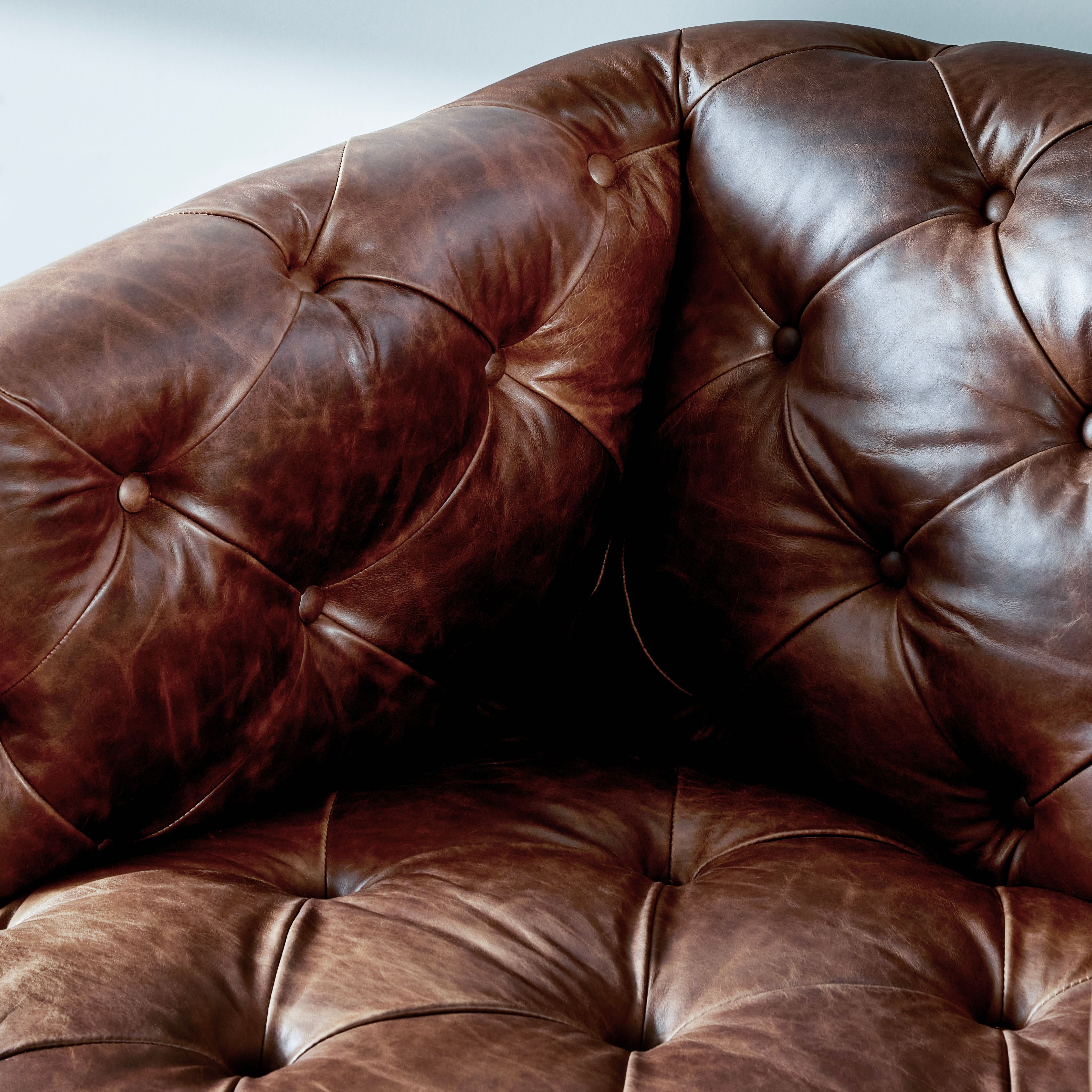 Old English-inspired top-grain leather is finished with a soft hand for a vintage, lived-in look on this traditionally inspired chair. Handcrafted in Italy, the richness of this distinctive, full-bodied leather develops an even-richer patina over time. Button tufting texturizes a comfortably curved back and sides, while a 360-degree swivel modernizes the whole look. Amethyst Home provides interior design, new construction, custom furniture, and area rugs in the Los Angeles metro area.