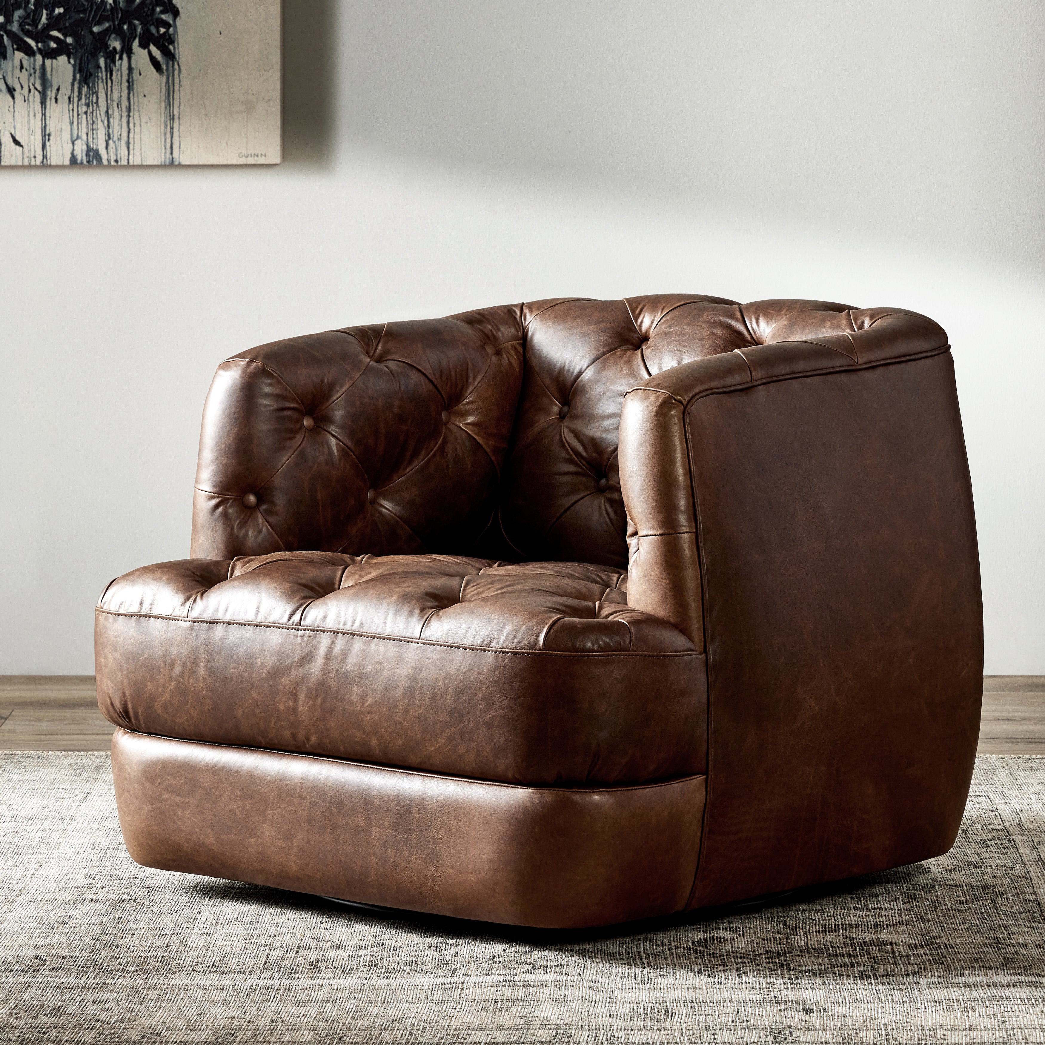 Old English-inspired top-grain leather is finished with a soft hand for a vintage, lived-in look on this traditionally inspired chair. Handcrafted in Italy, the richness of this distinctive, full-bodied leather develops an even-richer patina over time. Button tufting texturizes a comfortably curved back and sides, while a 360-degree swivel modernizes the whole look. Amethyst Home provides interior design, new construction, custom furniture, and area rugs in the Omaha metro area.