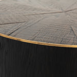 Bring on the drama. An ebony-finished oak top is cut in a starburst texture, framed by deep ebony sides, and encircled by bright brass-clad binding. Amethyst Home provides interior design, new construction, custom furniture, and area rugs in the Park City metro area.