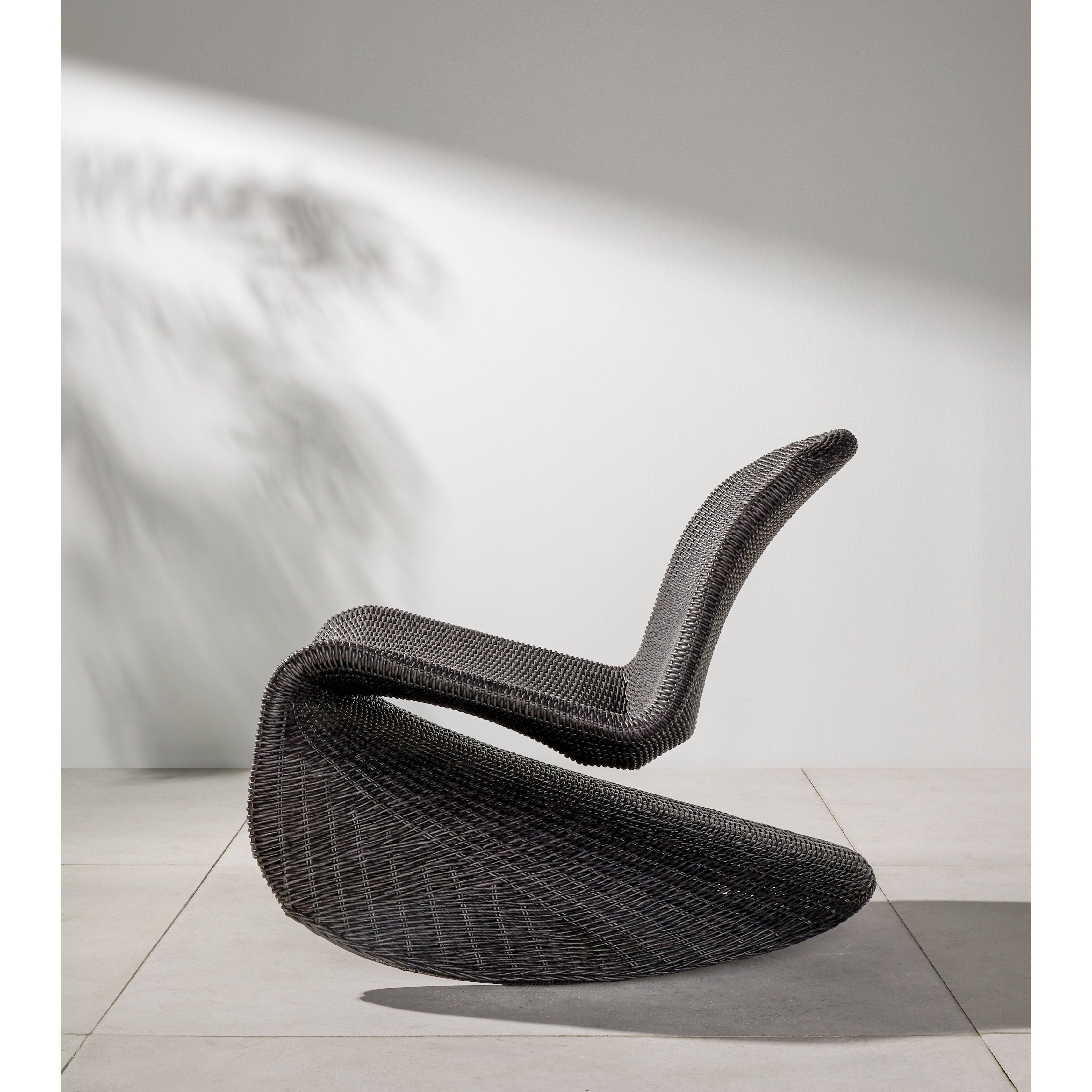 Based off a vintage shape, all-weather wicker seating brings dramatic curves to this statement-making rocking chair. Cover or store indoors during inclement weather and when not in use. Amethyst Home provides interior design, new construction, custom furniture, and area rugs in the Houston metro area.