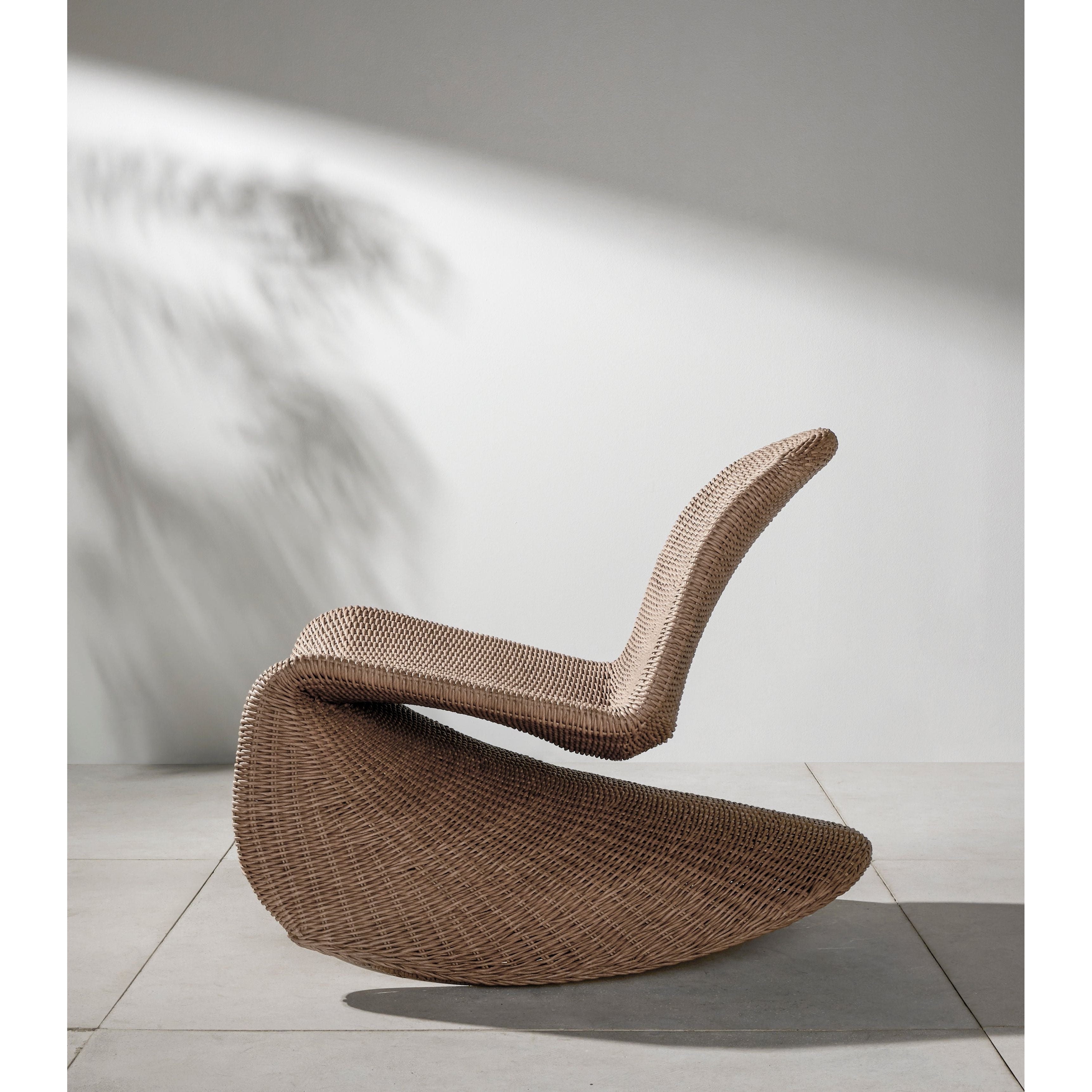 Based off a vintage shape, all-weather wicker seating brings dramatic curves to this statement-making rocking chair. Cover or store indoors during inclement weather and when not in use. Amethyst Home provides interior design, new construction, custom furniture, and area rugs in the Alpharetta metro area.