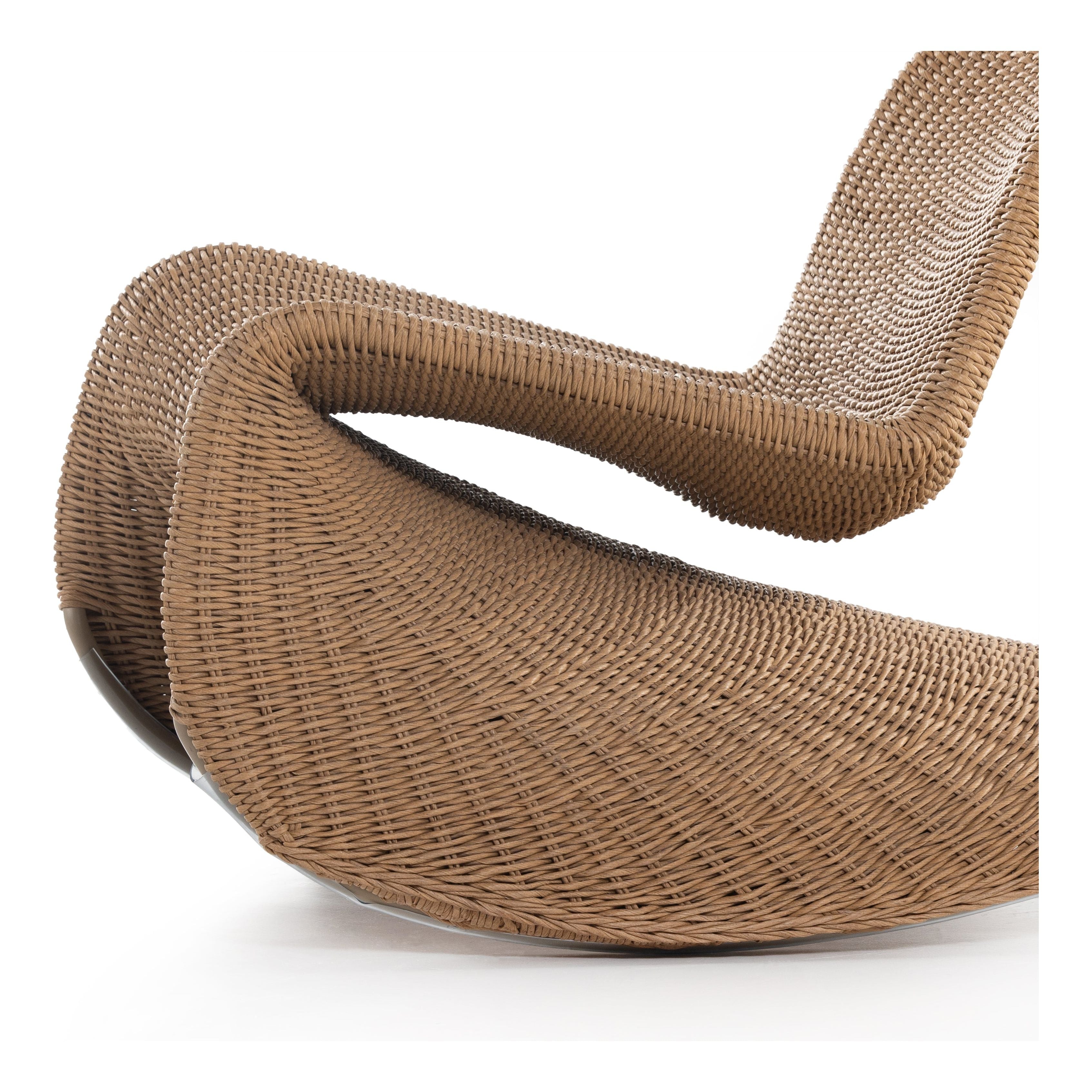 Based off a vintage shape, all-weather wicker seating brings dramatic curves to this statement-making rocking chair. Cover or store indoors during inclement weather and when not in use. Amethyst Home provides interior design, new construction, custom furniture, and area rugs in the Charlotte metro area.