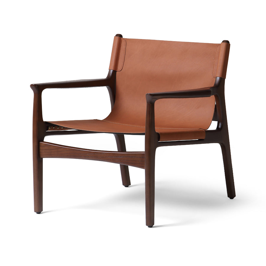 The classic sling chair gets a mid-century modern update. A solid ash frame features subtly curved arms and legs. Sling seating and back are made from 100% top-grain vegetable-tanned leather in a rich chestnut brown. Amethyst Home provides interior design, new construction, custom furniture, and area rugs in the Tampa metro area.