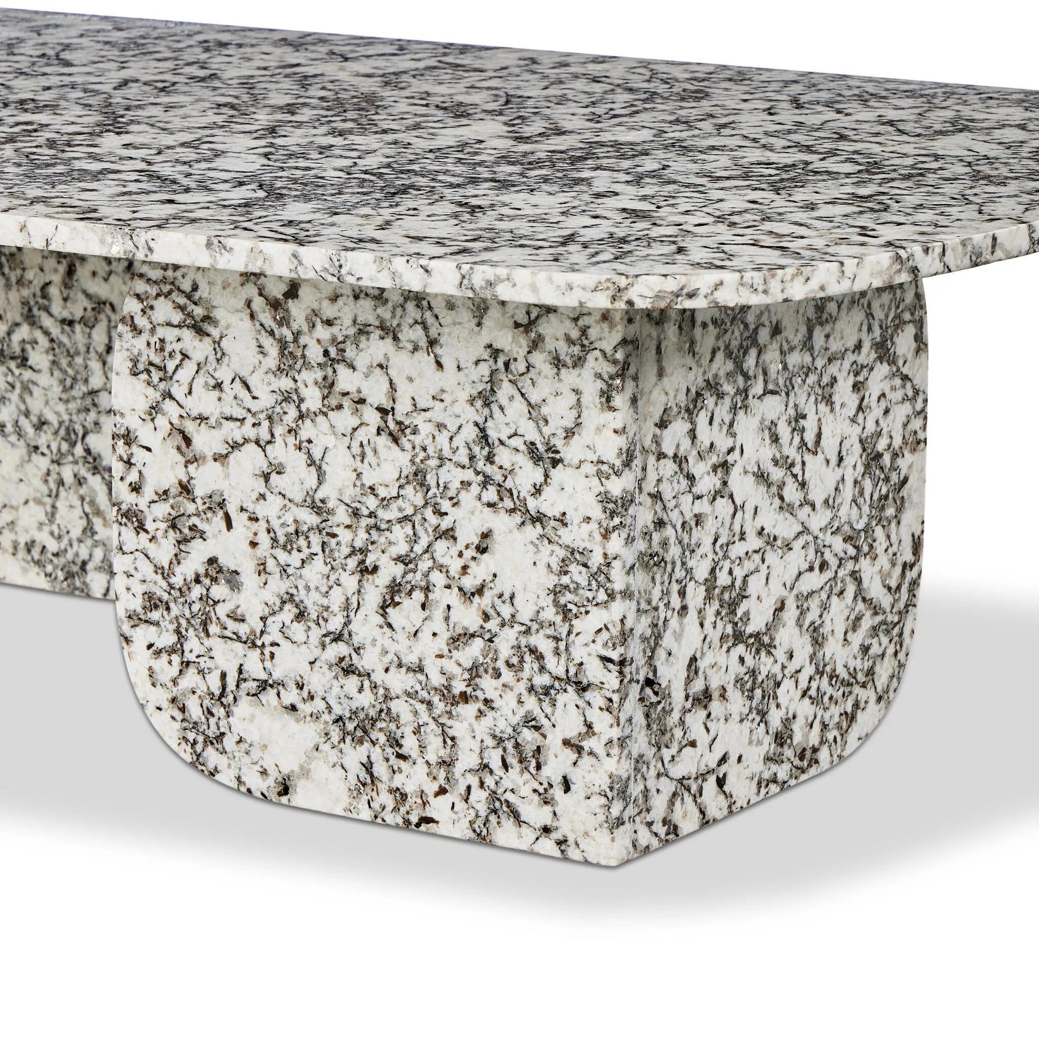 Speckled black marble shapes a unique coffee table with softened corners and subtle Eighties vibes.Collection: Marlo Amethyst Home provides interior design, new home construction design consulting, vintage area rugs, and lighting in the Monterey metro area.
