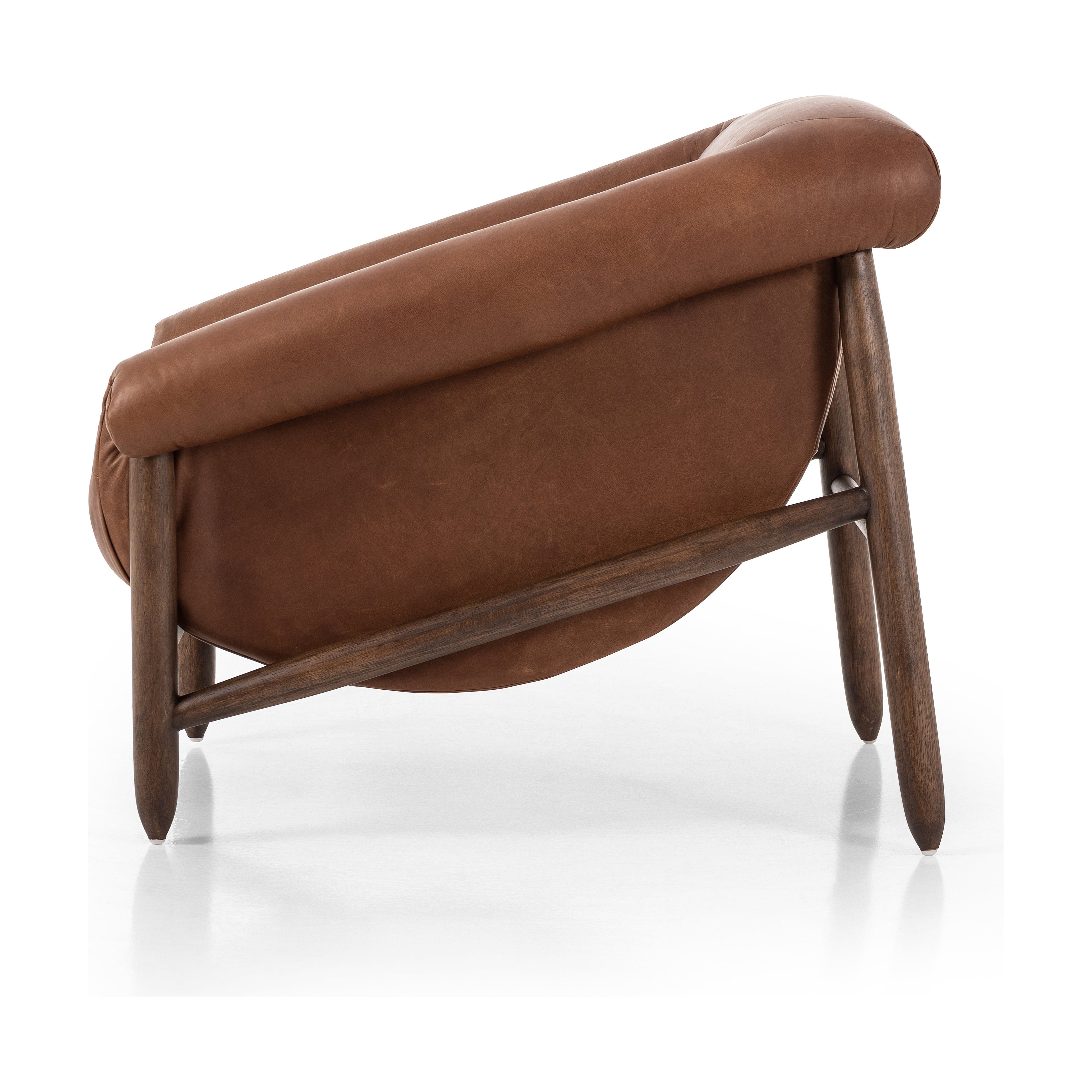 Featuring Reggie Heirloom Sienna Chair by Four Hands at Amethyst Home. Oversized cushioning brings a Brazilian midcentury feel to this vintage-inspired chair. Designed with cushion-wrapped slanted arms, fixed cushioning with a deep sit and narrow legs reminiscent of midcentury style. Sourced from one of the oldest family-owned tanneries in Italy's Bassano del Grappa, heirloom le. Amethyst Home provides interior design, new construction, custom furniture, and area rugs in the Alpharetta metro area.