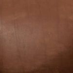 Featuring Reggie Heirloom Sienna Chair by Four Hands at Amethyst Home. Oversized cushioning brings a Brazilian midcentury feel to this vintage-inspired chair. Designed with cushion-wrapped slanted arms, fixed cushioning with a deep sit and narrow legs reminiscent of midcentury style. Sourced from one of the oldest family-owned tanneries in Italy's Bassano del Grappa, heirloom lea. Amethyst Home provides interior design, new construction, custom furniture, and area rugs in the Calabasas metro area.