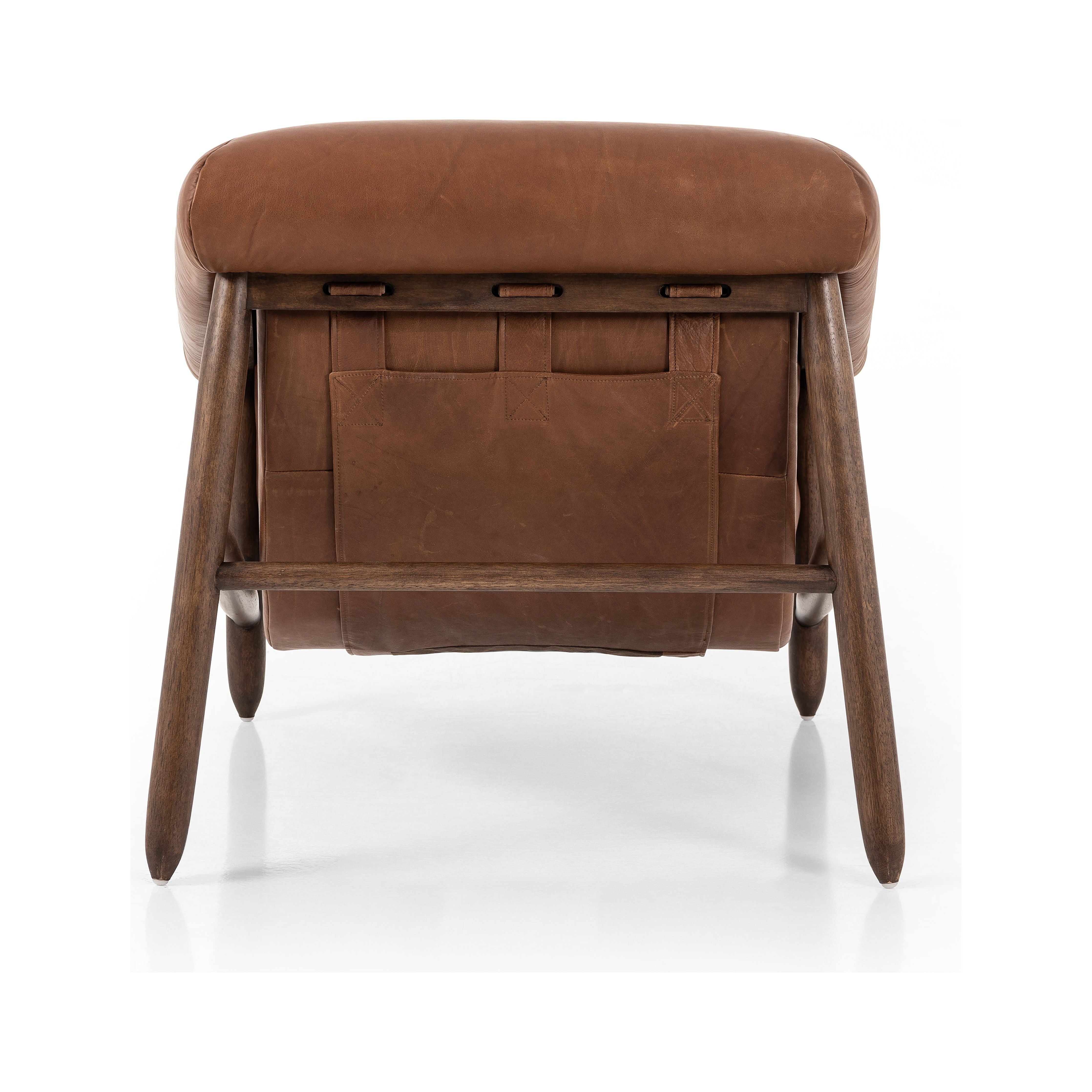 Featuring Reggie Heirloom Sienna Chair by Four Hands at Amethyst Home. Oversized cushioning brings a Brazilian midcentury feel to this vintage-inspired chair. Designed with cushion-wrapped slanted arms, fixed cushioning with a deep sit and narrow legs reminiscent of midcentury style. Sourced from one of the oldest family-owned tanneries in Italy's Bassano del Grappa, heirloom leathe. Amethyst Home provides interior design, new construction, custom furniture, and area rugs in the Dallas metro area.