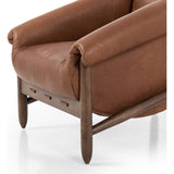 Featuring Reggie Heirloom Sienna Chair by Four Hands at Amethyst Home. Oversized cushioning brings a Brazilian midcentury feel to this vintage-inspired chair. Designed with cushion-wrapped slanted arms, fixed cushioning with a deep sit and narrow legs reminiscent of midcentury style. Sourced from one of the oldest family-owned tanneries in Italy's Bassano del Grappa, heirloom l. Amethyst Home provides interior design, new construction, custom furniture, and area rugs in the Los Angeles metro area.