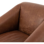 Featuring Reggie Heirloom Sienna Chair by Four Hands at Amethyst Home. Oversized cushioning brings a Brazilian midcentury feel to this vintage-inspired chair. Designed with cushion-wrapped slanted arms, fixed cushioning with a deep sit and narrow legs reminiscent of midcentury style. Sourced from one of the oldest family-owned tanneries in Italy's Bassano del Grappa, heirloom leather. Amethyst Home provides interior design, new construction, custom furniture, and area rugs in the Omaha metro area.