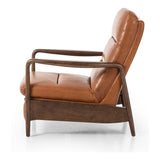 A sleek seat with hidden push-back reclining functionality. This midcentury-inspired recliner features wide chunky channeling paired with slim paddle arms and a tapered wood frame. Designed with a high seat and high back for extra comfy support. Upholstered in a timeless tobacco-hued leather made in a family-owned tannery in Thailand. Amethyst Home provides interior design, new construction, custom furniture, and area rugs in the Houston metro area.