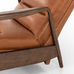A sleek seat with hidden push-back reclining functionality. This midcentury-inspired recliner features wide chunky channeling paired with slim paddle arms and a tapered wood frame. Designed with a high seat and high back for extra comfy support. Upholstered in a timeless tobacco-hued leather made in a family-owned tannery in Thailand. Amethyst Home provides interior design, new construction, custom furniture, and area rugs in the Winter Garden metro area.
