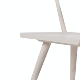 This new take on the mid-century Windsor chair, the Ripley Off White Dining Chair has a bowed, sculptural silhouette. The dining chair is done in an off-white finish to highlight the natural grain of weathered oak. Amethyst Home provides interior design, new construction, custom furniture, and rugs for the Calabasas metro area.