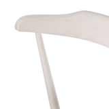 This new take on the mid-century Windsor chair, the Ripley Off White Dining Chair has a bowed, sculptural silhouette. The dining chair is done in an off-white finish to highlight the natural grain of weathered oak. Amethyst Home provides interior design, new construction, custom furniture, and rugs for the Denver metro area.