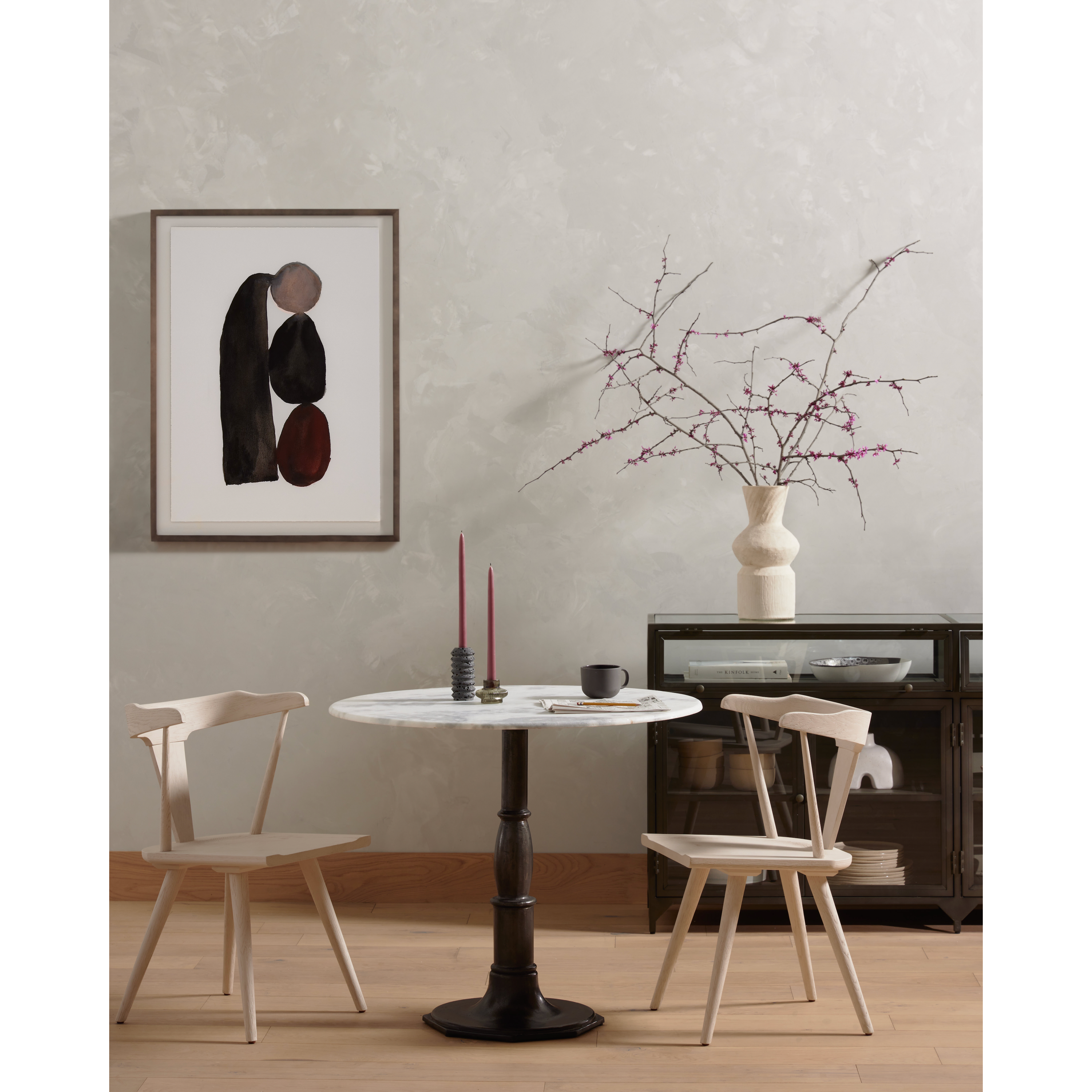 This new take on the mid-century Windsor chair, the Ripley Off White Dining Chair has a bowed, sculptural silhouette. The dining chair is done in an off-white finish to highlight the natural grain of weathered oak. Amethyst Home provides interior design, new construction, custom furniture, and rugs for the Des Moines metro area.