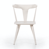 This new take on the mid-century Windsor chair, the Ripley Off White Dining Chair has a bowed, sculptural silhouette. The dining chair is done in an off-white finish to highlight the natural grain of weathered oak. Amethyst Home provides interior design, new construction, custom furniture, and rugs for the Nashville metro area.