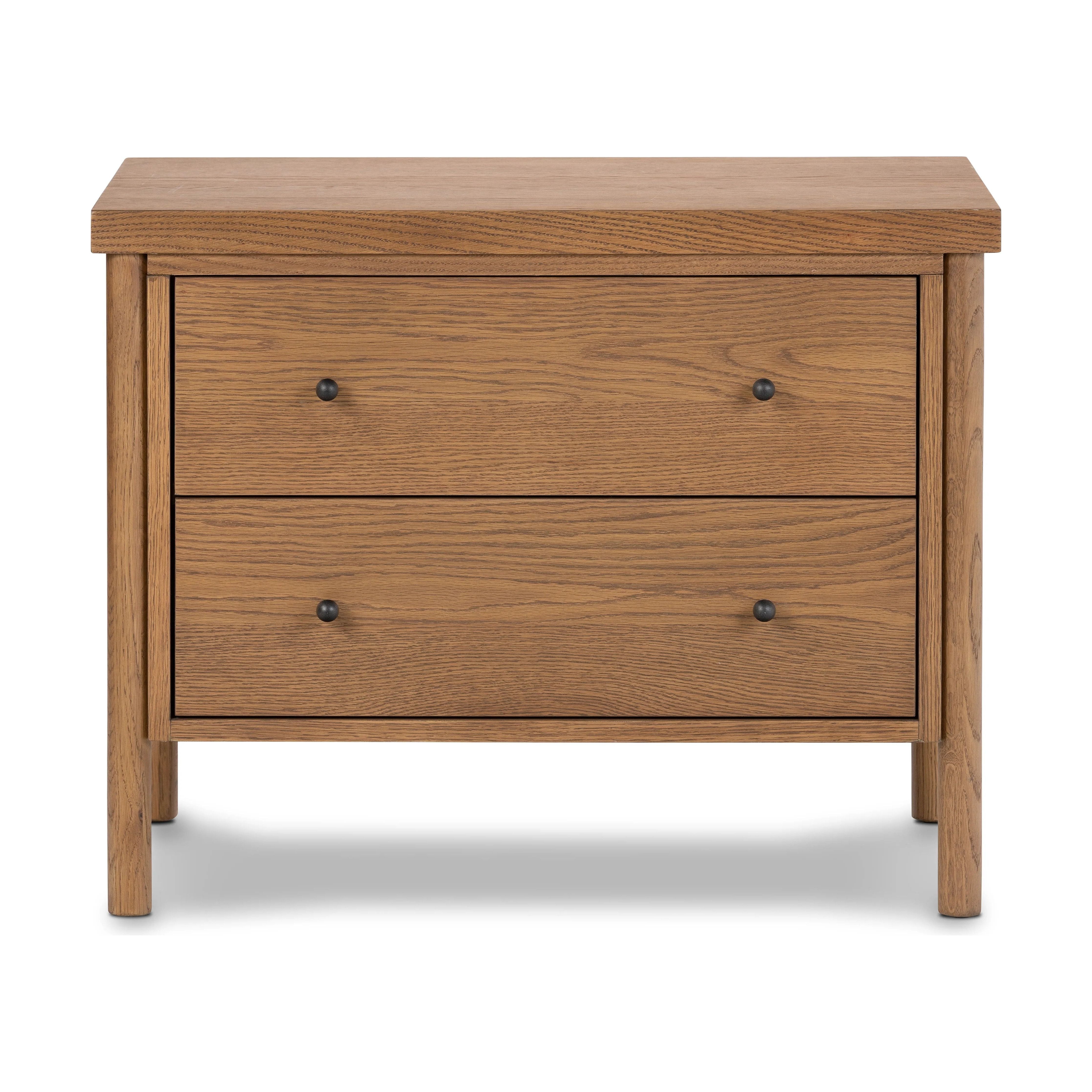 Rounded, chunky dowel legs in an amber oak finish support the overhang top of of this nightstand. Two drawers provide ample storage, finished with simple gunmetal hardware Amethyst Home provides interior design, new home construction design consulting, vintage area rugs, and lighting in the Houston metro area.