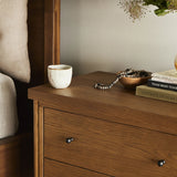 Rounded, chunky dowel legs in an amber oak finish support the overhang top of of this nightstand. Two drawers provide ample storage, finished with simple gunmetal hardware Amethyst Home provides interior design, new home construction design consulting, vintage area rugs, and lighting in the Nashville metro area.
