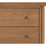 Rounded, chunky dowel legs in an amber oak finish support the overhang top of of this nightstand. Two drawers provide ample storage, finished with simple gunmetal hardware Amethyst Home provides interior design, new home construction design consulting, vintage area rugs, and lighting in the Omaha metro area.