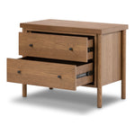 Rounded, chunky dowel legs in an amber oak finish support the overhang top of of this nightstand. Two drawers provide ample storage, finished with simple gunmetal hardware Amethyst Home provides interior design, new home construction design consulting, vintage area rugs, and lighting in the Portland metro area.