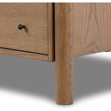 Rounded, chunky dowel legs in an amber oak finish support the overhang top of of this dresser. Six drawers provide ample storage, finished with simple gunmetal hardware Amethyst Home provides interior design, new home construction design consulting, vintage area rugs, and lighting in the Des Moines metro area.