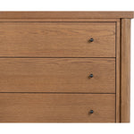Rounded, chunky dowel legs in an amber oak finish support the overhang top of of this dresser. Six drawers provide ample storage, finished with simple gunmetal hardware Amethyst Home provides interior design, new home construction design consulting, vintage area rugs, and lighting in the Omaha metro area.