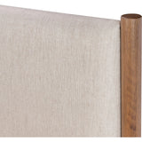 Rounded, chunky dowel legs in an amber oak finish frame the neutral, linen-like upholstered headboard of this bed frame.Collection: Bolto Amethyst Home provides interior design, new home construction design consulting, vintage area rugs, and lighting in the Calabasas metro area.