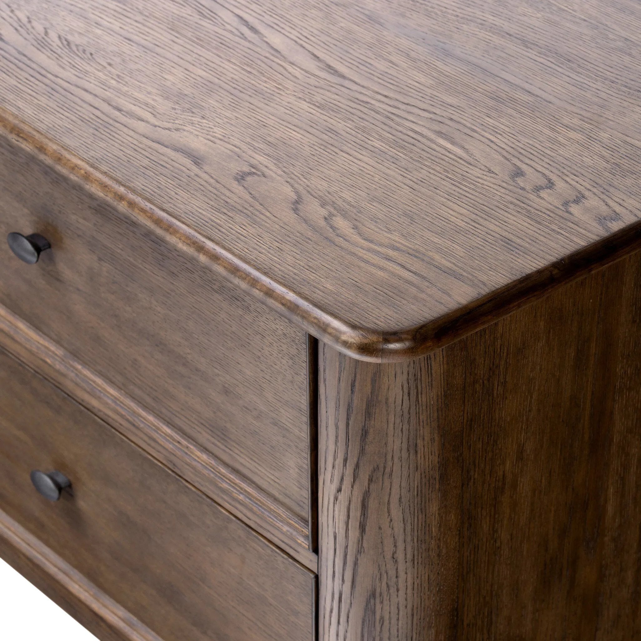 Like an heirloom nightstand with two roomy drawers, this aged oak design has room for it all. Detailed with an overhang surface, carved edges top to bottom, angled legs and oval drawer pulls finished in dark gunmetal.Collection: Bolto Amethyst Home provides interior design, new home construction design consulting, vintage area rugs, and lighting in the Calabasas metro area.