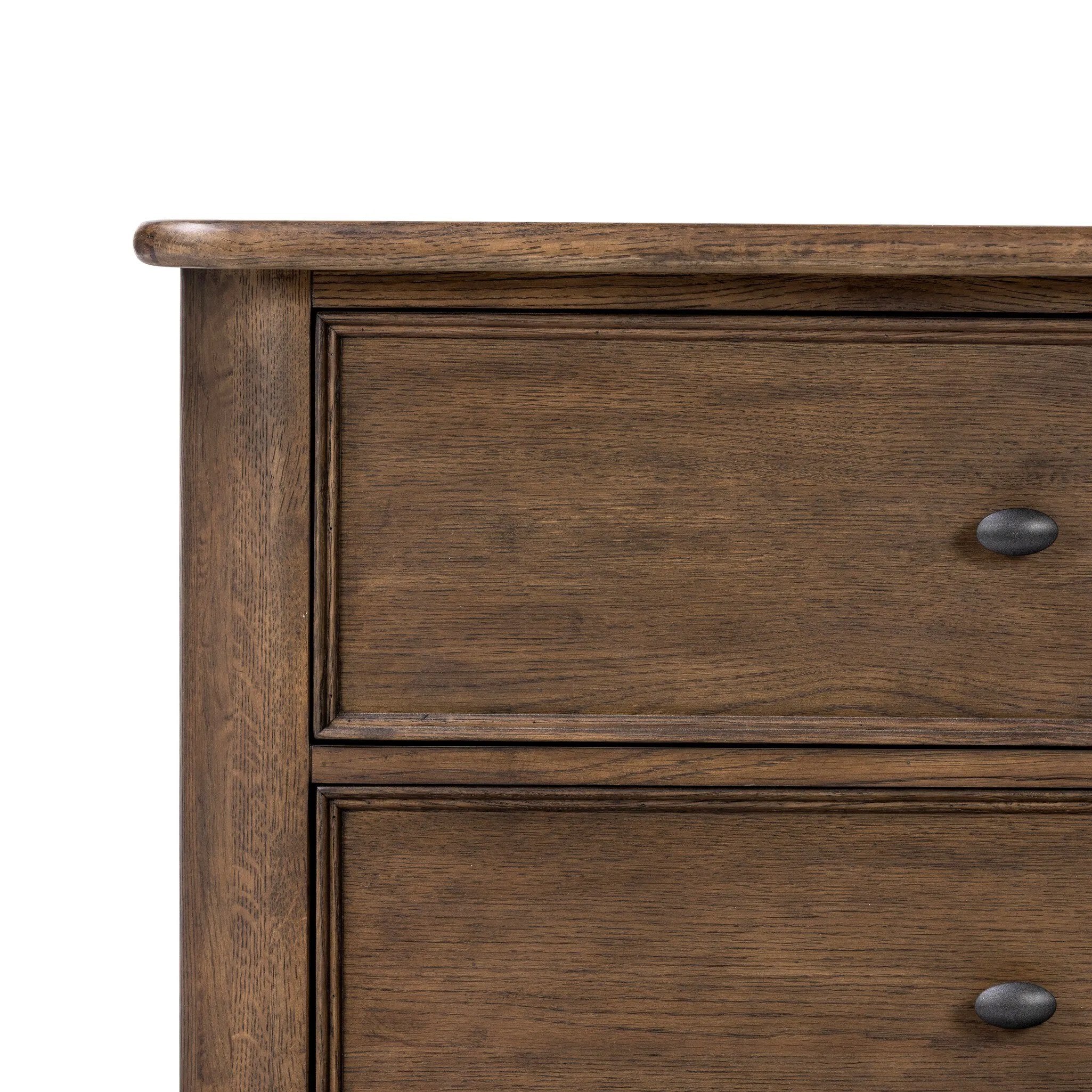 Like an heirloom nightstand with two roomy drawers, this aged oak design has room for it all. Detailed with an overhang surface, carved edges top to bottom, angled legs and oval drawer pulls finished in dark gunmetal.Collection: Bolto Amethyst Home provides interior design, new home construction design consulting, vintage area rugs, and lighting in the Newport Beach metro area.