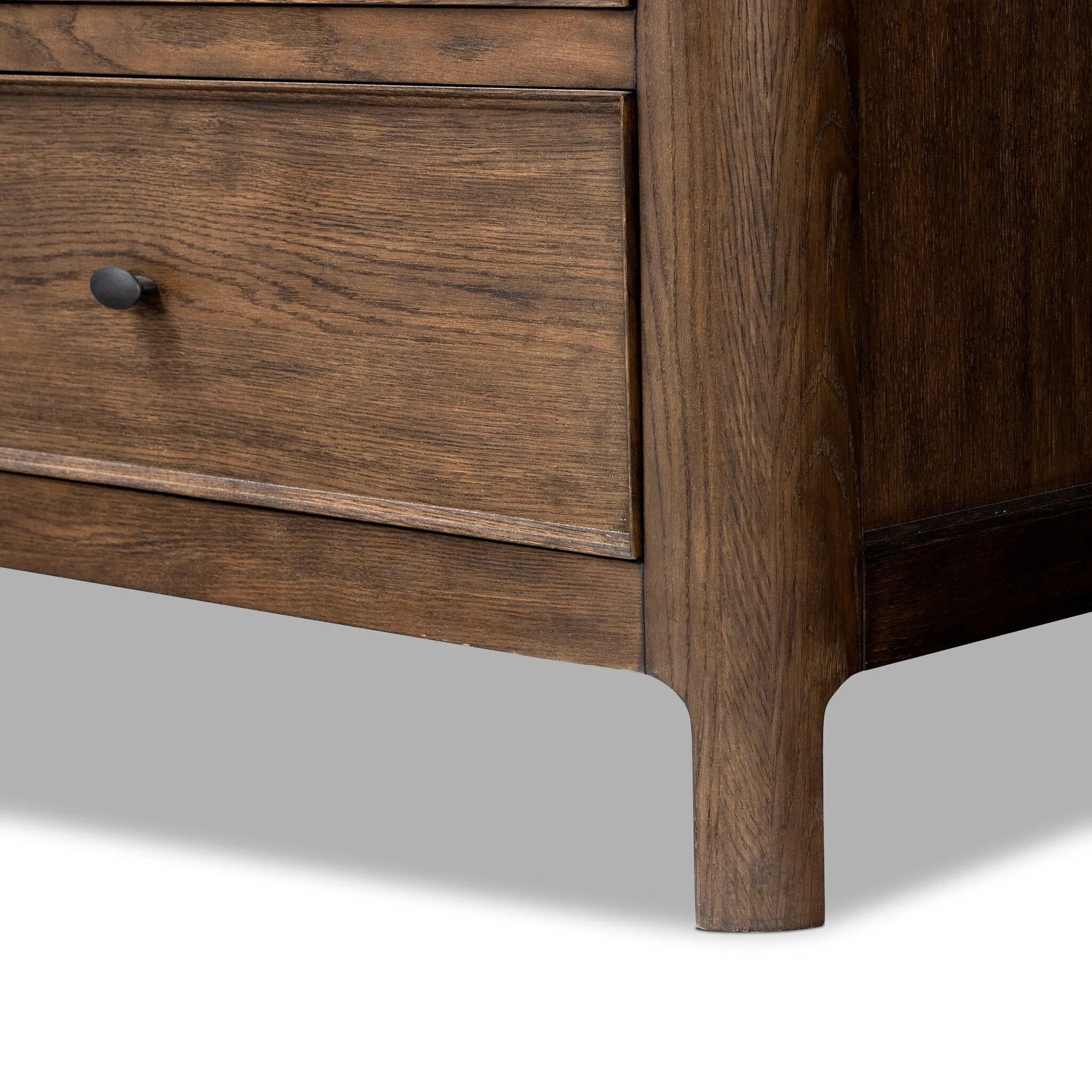 Like an heirloom dresser with three smaller drawers up top, this aged oak design has room for it all. Detailed with an overhang surface, carved edges top to bottom, angled legs and oval drawer pulls finished in dark gunmetal.Collection: Bolto Amethyst Home provides interior design, new home construction design consulting, vintage area rugs, and lighting in the Dallas metro area.