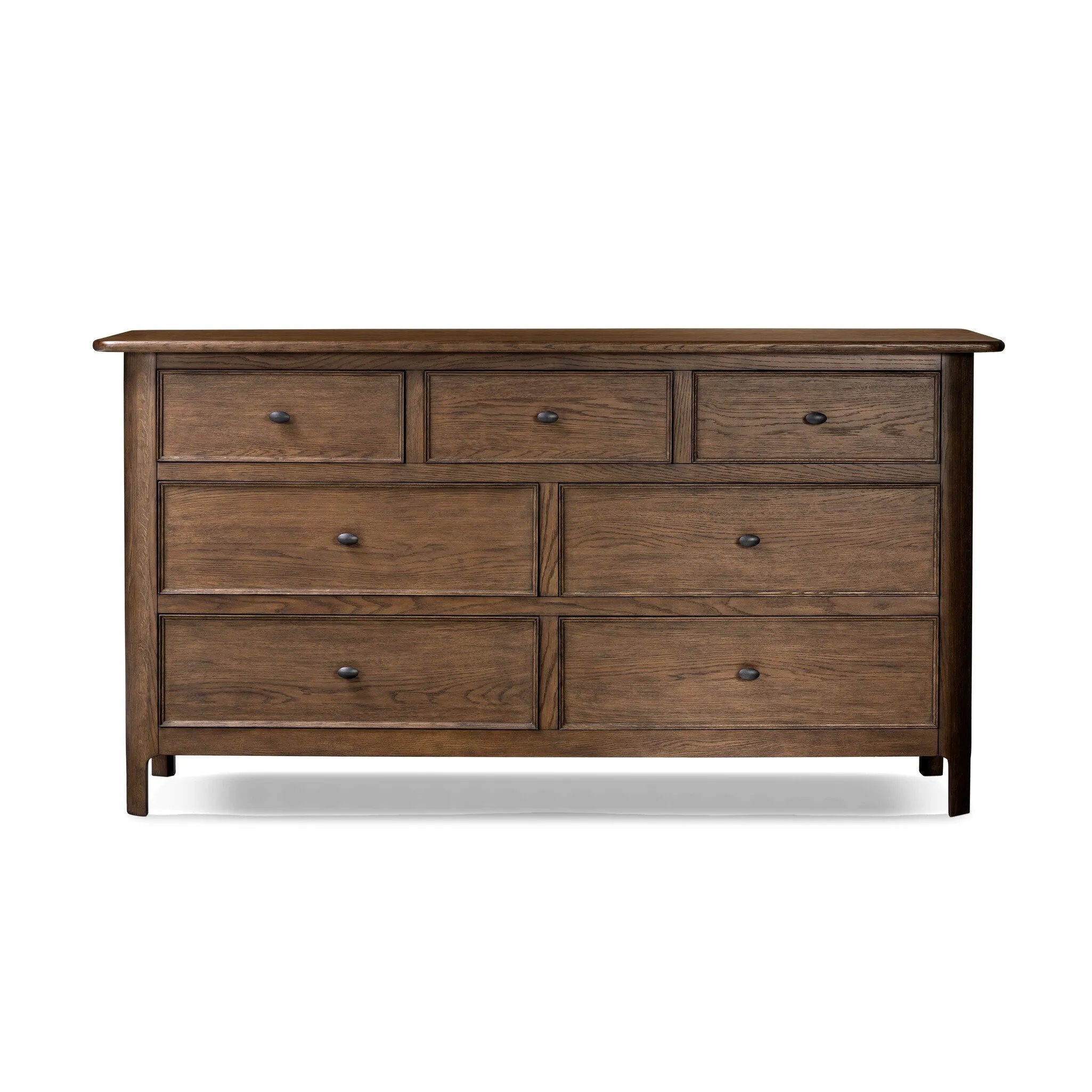Like an heirloom dresser with three smaller drawers up top, this aged oak design has room for it all. Detailed with an overhang surface, carved edges top to bottom, angled legs and oval drawer pulls finished in dark gunmetal.Collection: Bolto Amethyst Home provides interior design, new home construction design consulting, vintage area rugs, and lighting in the Houston metro area.