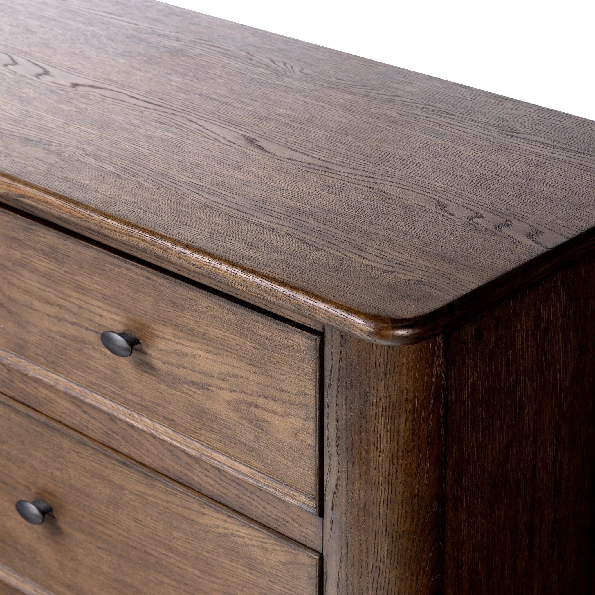 Like an heirloom dresser with three smaller drawers up top, this aged oak design has room for it all. Detailed with an overhang surface, carved edges top to bottom, angled legs and oval drawer pulls finished in dark gunmetal.Collection: Bolto Amethyst Home provides interior design, new home construction design consulting, vintage area rugs, and lighting in the Los Angeles metro area.