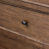 Like an heirloom dresser with three smaller drawers up top, this aged oak design has room for it all. Detailed with an overhang surface, carved edges top to bottom, angled legs and oval drawer pulls finished in dark gunmetal.Collection: Bolto Amethyst Home provides interior design, new home construction design consulting, vintage area rugs, and lighting in the Nashville metro area.