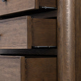 Like an heirloom tallboy with six drawers, this aged oak dresser has room for it all. Detailed with an overhang surface, carved edges top to bottom, angled legs and oval drawer pulls finished in dark gunmetal.Collection: Bolto Amethyst Home provides interior design, new home construction design consulting, vintage area rugs, and lighting in the Boston metro area.