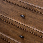 Like an heirloom tallboy with six drawers, this aged oak dresser has room for it all. Detailed with an overhang surface, carved edges top to bottom, angled legs and oval drawer pulls finished in dark gunmetal.Collection: Bolto Amethyst Home provides interior design, new home construction design consulting, vintage area rugs, and lighting in the Dallas metro area.
