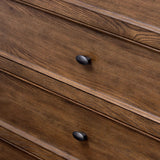 Like an heirloom tallboy with six drawers, this aged oak dresser has room for it all. Detailed with an overhang surface, carved edges top to bottom, angled legs and oval drawer pulls finished in dark gunmetal.Collection: Bolto Amethyst Home provides interior design, new home construction design consulting, vintage area rugs, and lighting in the Dallas metro area.